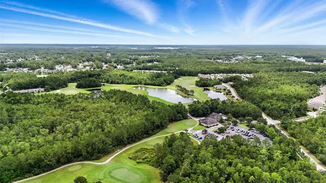 an aerial view of a house with outdoor space