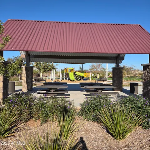 a view of a patio with wooden fence