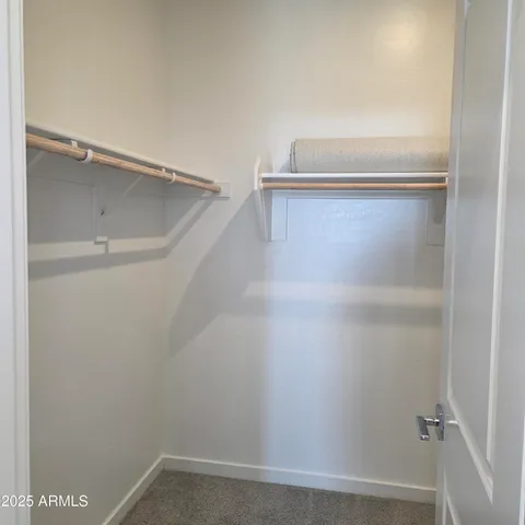 a view of an empty walk in closet