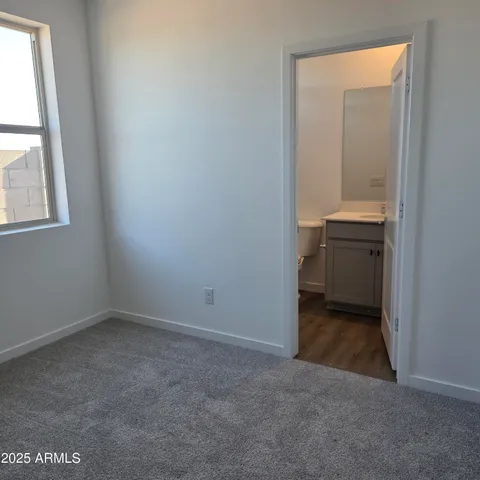 an empty room with a bathroom