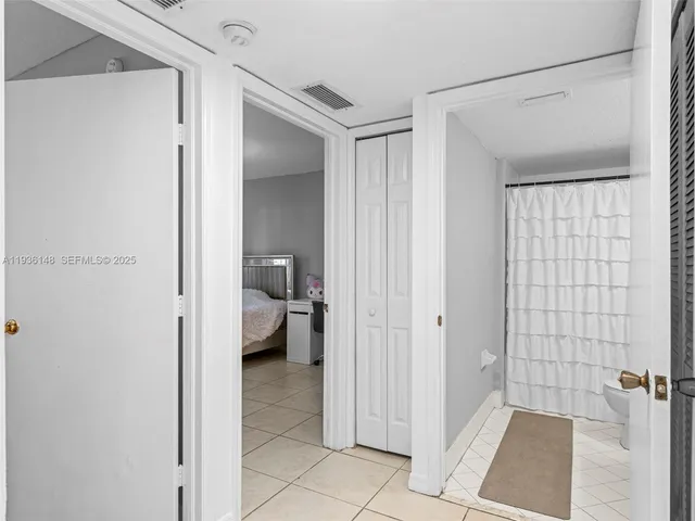 a view of a bathroom from a hallway