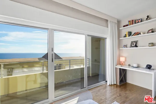 a view of a balcony with an outdoor space