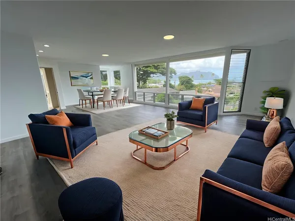 a living room with furniture and a large window