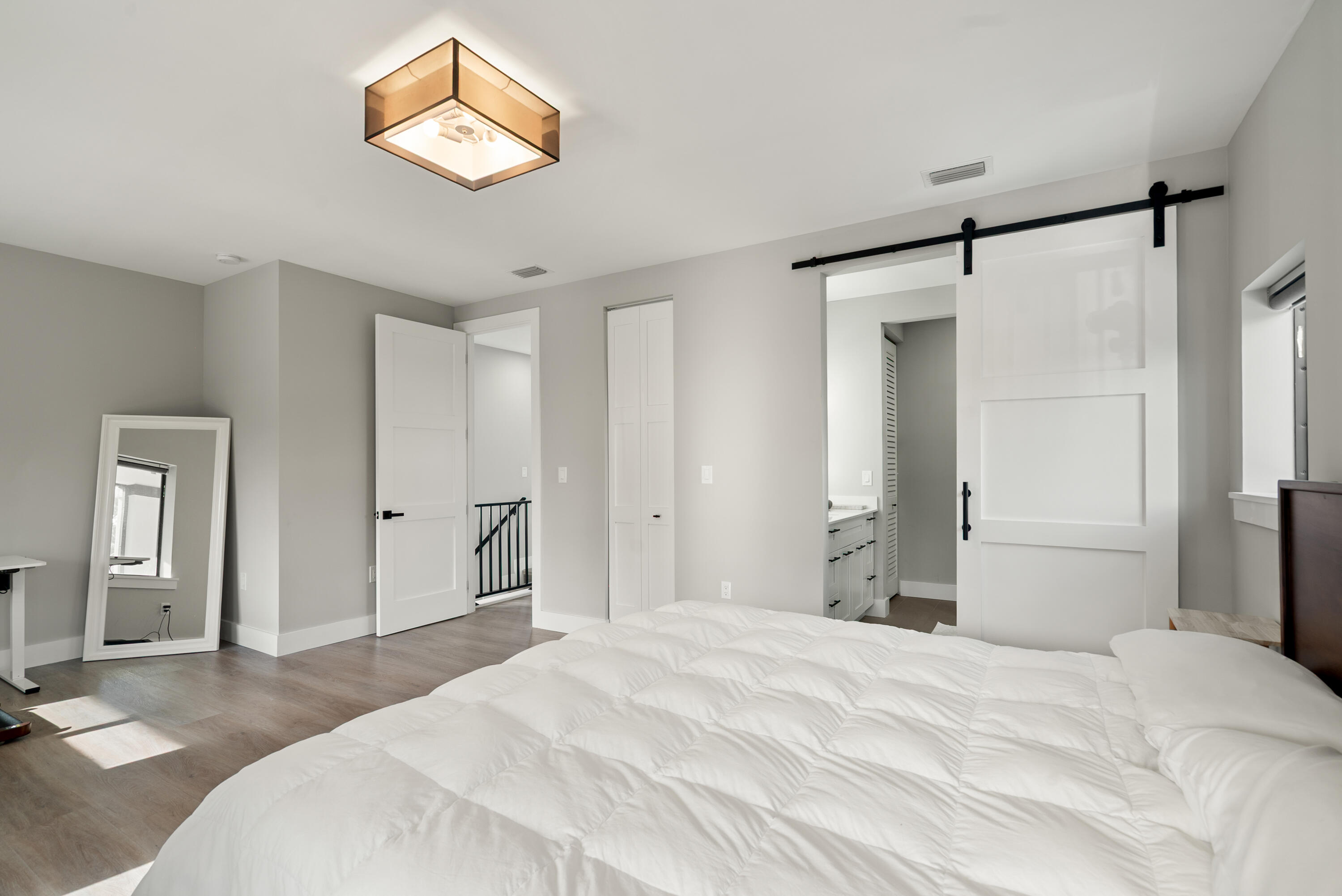 13 Coral Way Key Largo, FL 33037 - Photo 10 of 34 a bedroom with a bed and a chandelier