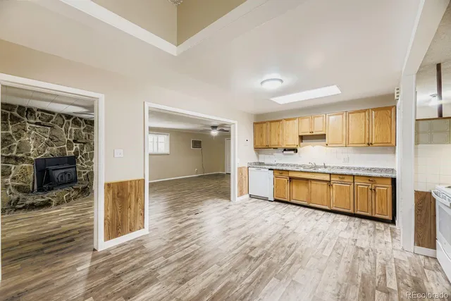 a large kitchen with granite countertop a large counter top and sink