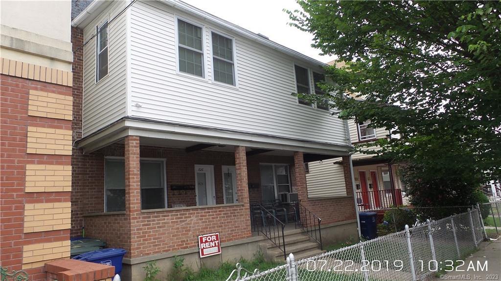 824 Capitol Avenue, Unit 2 Bridgeport, CT 06606 - Photo 1 of 9 a view of a house with a yard and potted plants
