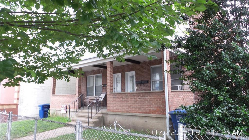 824 Capitol Avenue, Unit 2 Bridgeport, CT 06606 - Photo 2 of 9 a front view of a house with garden