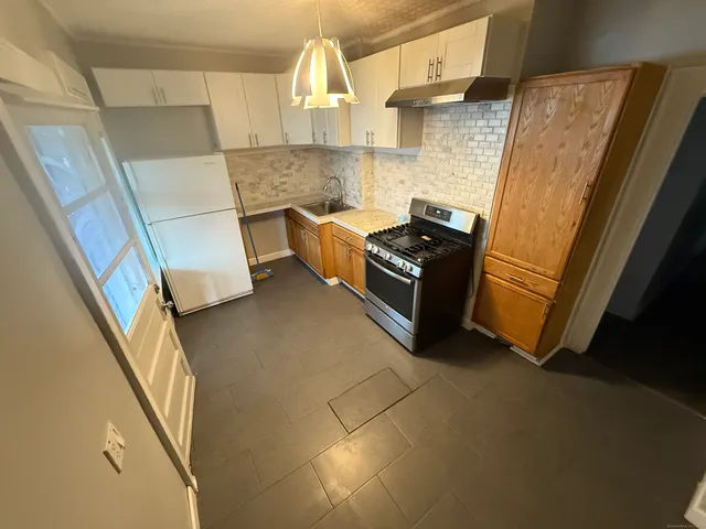 a view of kitchen and wooden floor