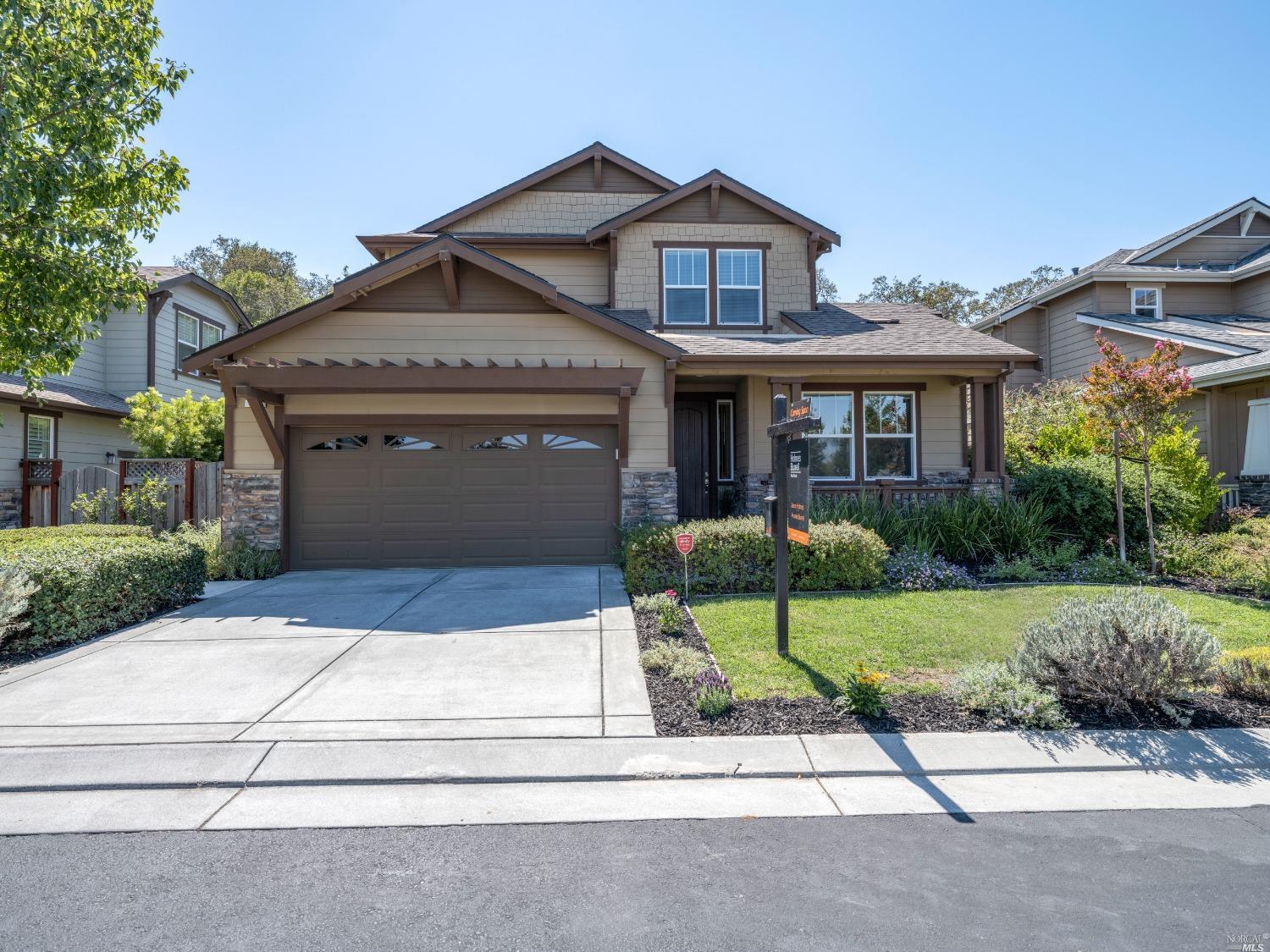 14 Canyon Green Loop Novato, CA 94947 - Photo 1 of 1 a front view of a house with a garden and garage