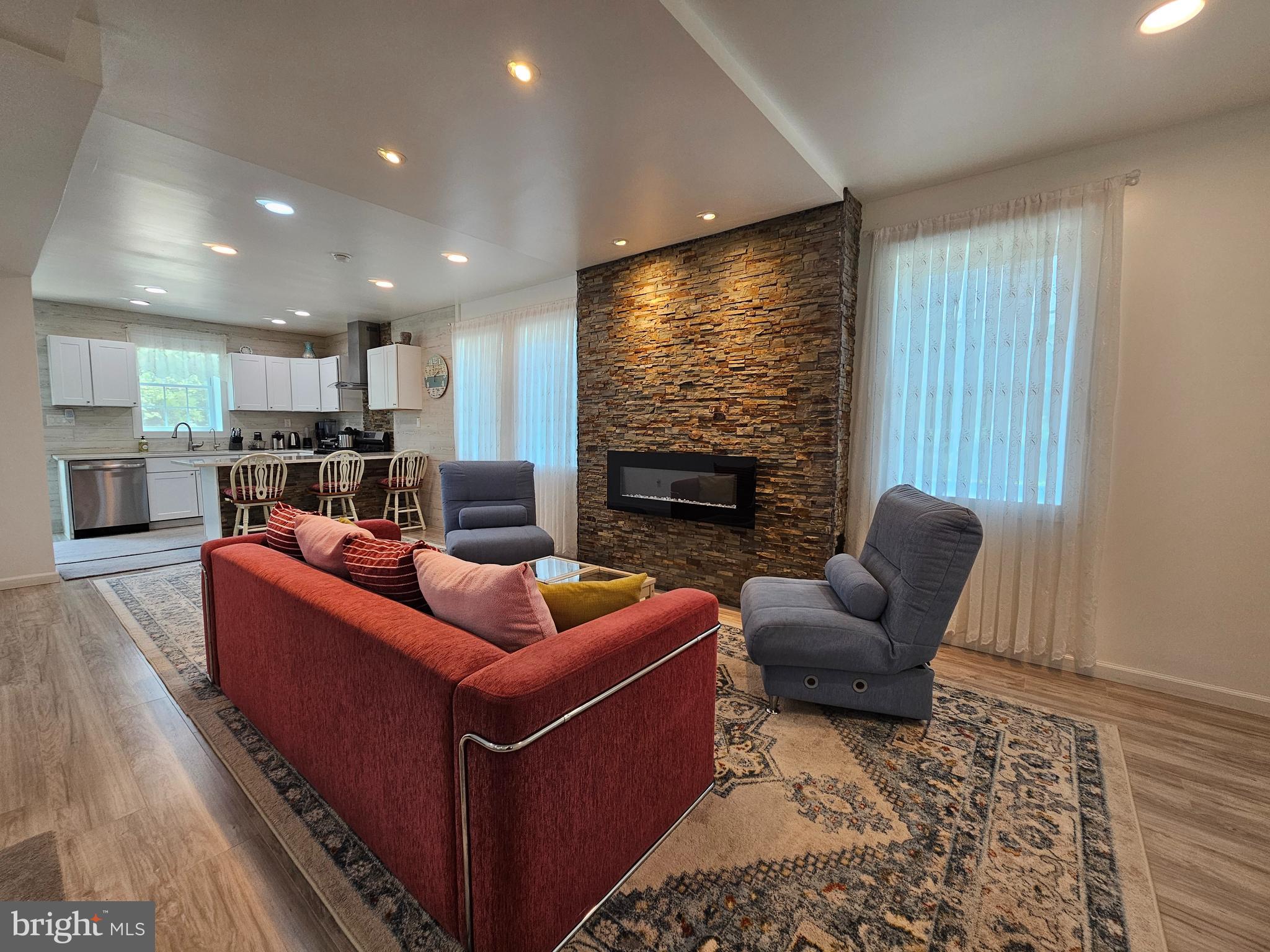 836 New Brooklyn Road Williamstown, NJ 08094 - Photo 15 of 78 a living room with furniture and a fireplace