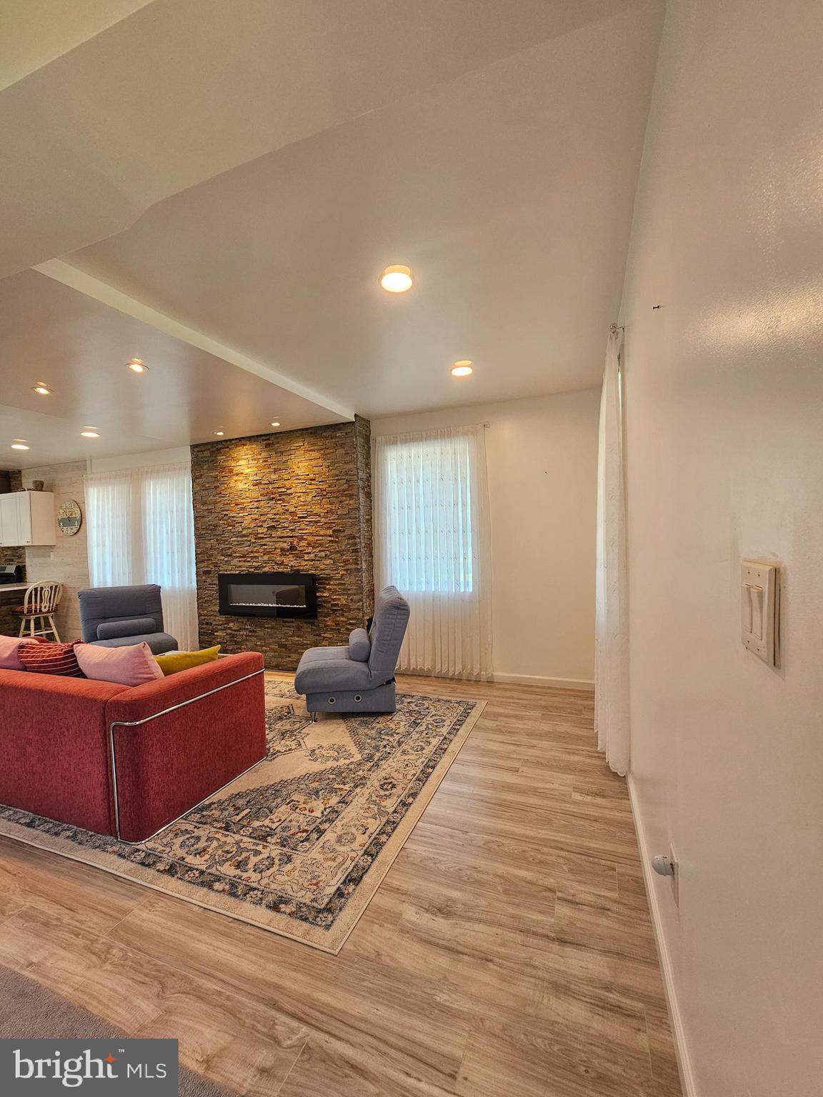 836 New Brooklyn Road Williamstown, NJ 08094 - Photo 4 of 78 a living room with furniture and a flat screen tv
