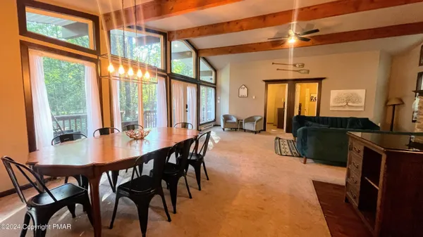 a view of a dining room with furniture window and outside view