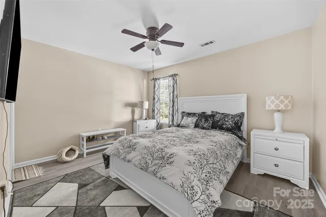 a bedroom with a large bed and a window