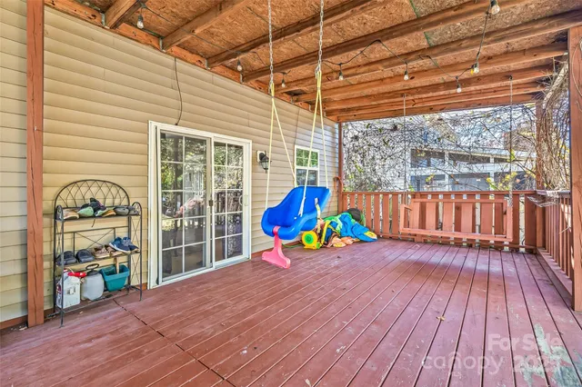 a view of a patio with wooden floor