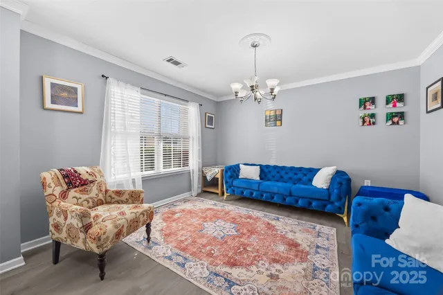 a living room with furniture bathtub and a chandelier