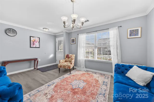 a kitchen with a refrigerator sink and cabinets