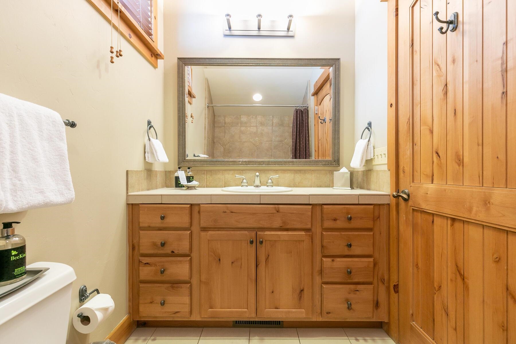 12267 Lookout Loop, Unit F713 Truckee, CA 96161 - Photo 21 of 26 a bathroom with a sink and a mirror