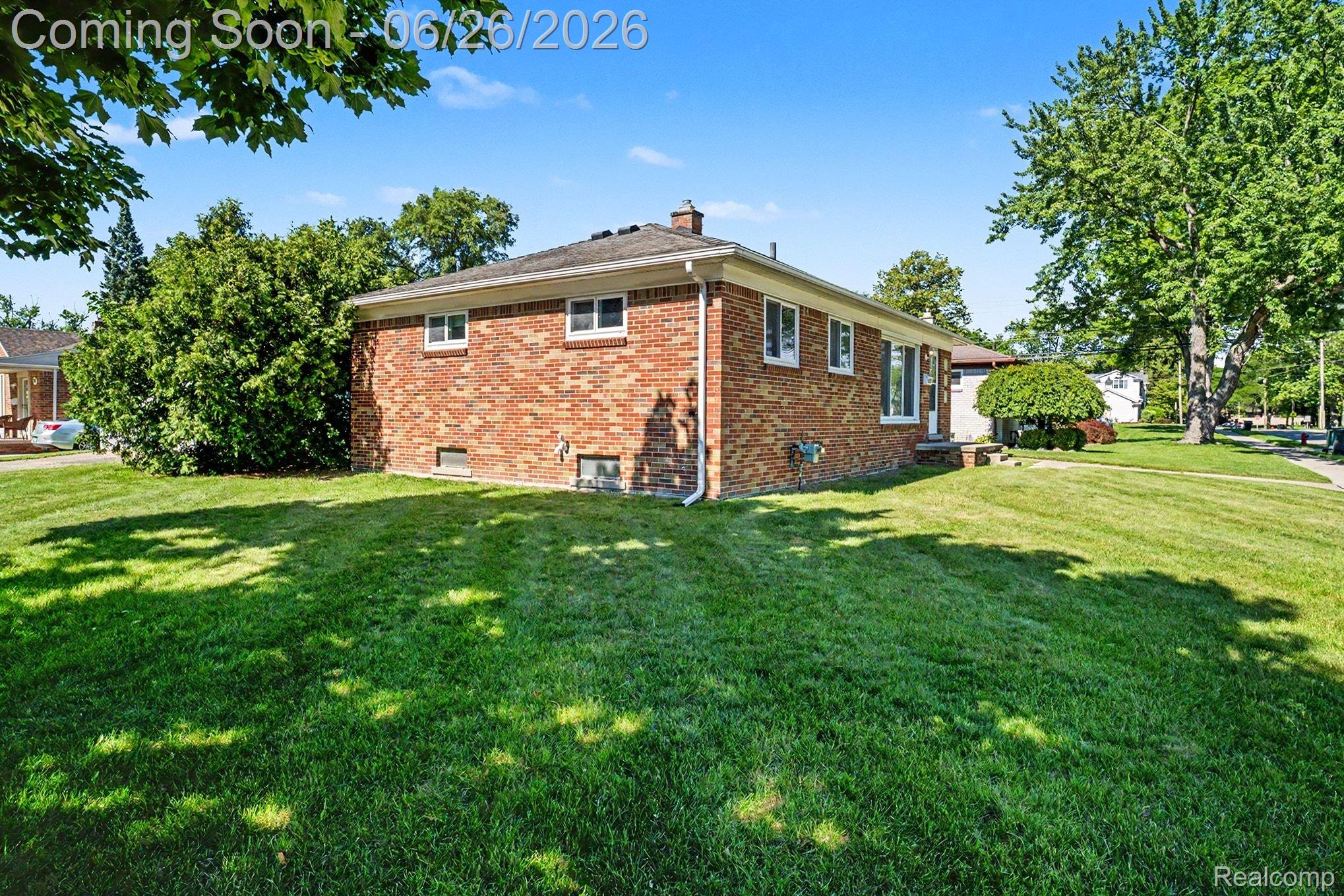 1209 Massoit Road Clawson, MI 48017 - Photo 22 of 25 Brick exterior residence featuring multiple windows and a gabled roofline