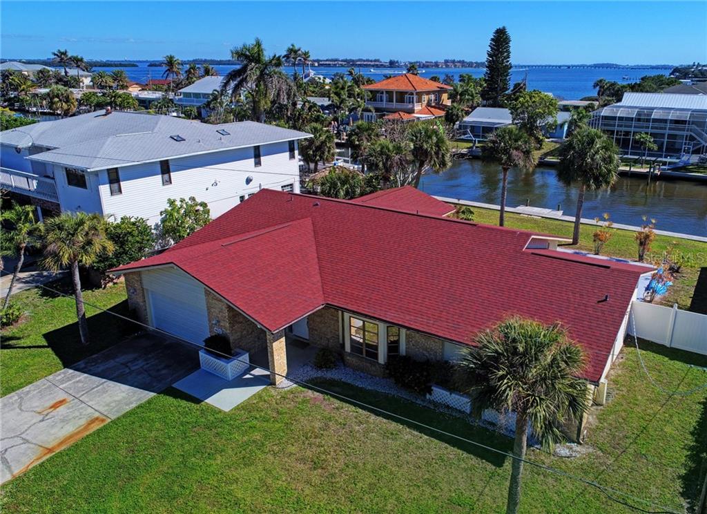 403 28th Street Holmes Beach, FL 34217 - Photo 1 of 1 an aerial view of a house with swimming pool garden and patio