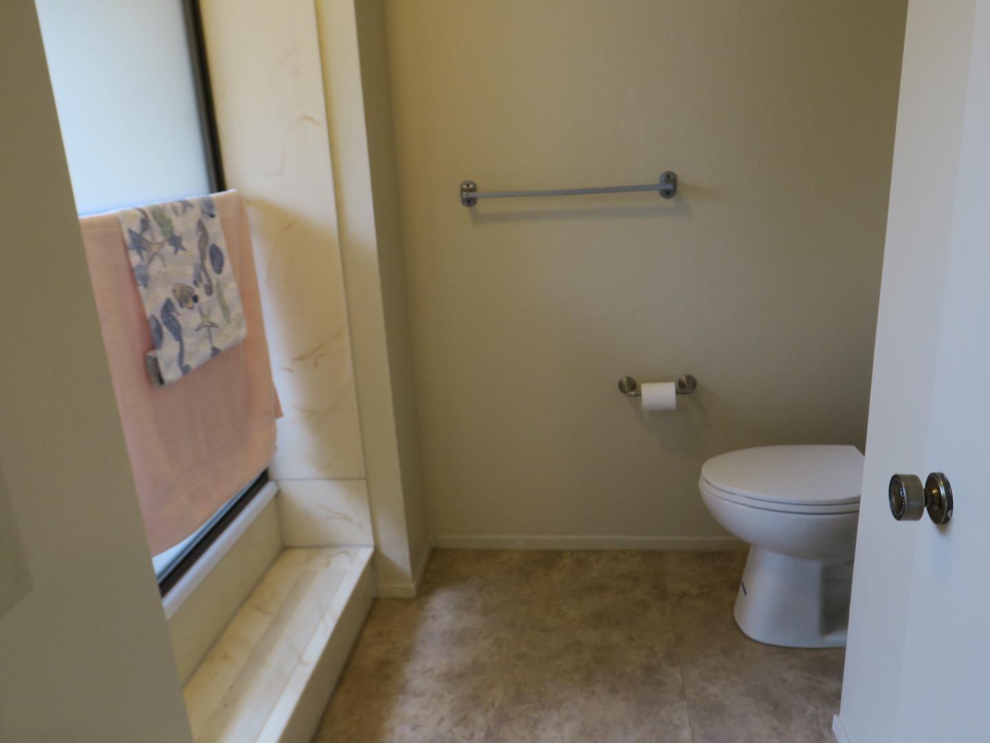 291 Klamath Road Milpitas, CA 95035 - Photo 12 of 20 a white toilet sitting next to a bathroom sink