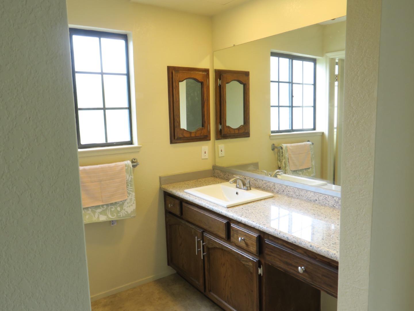291 Klamath Road Milpitas, CA 95035 - Photo 14 of 20 a bathroom with a sink and a mirror