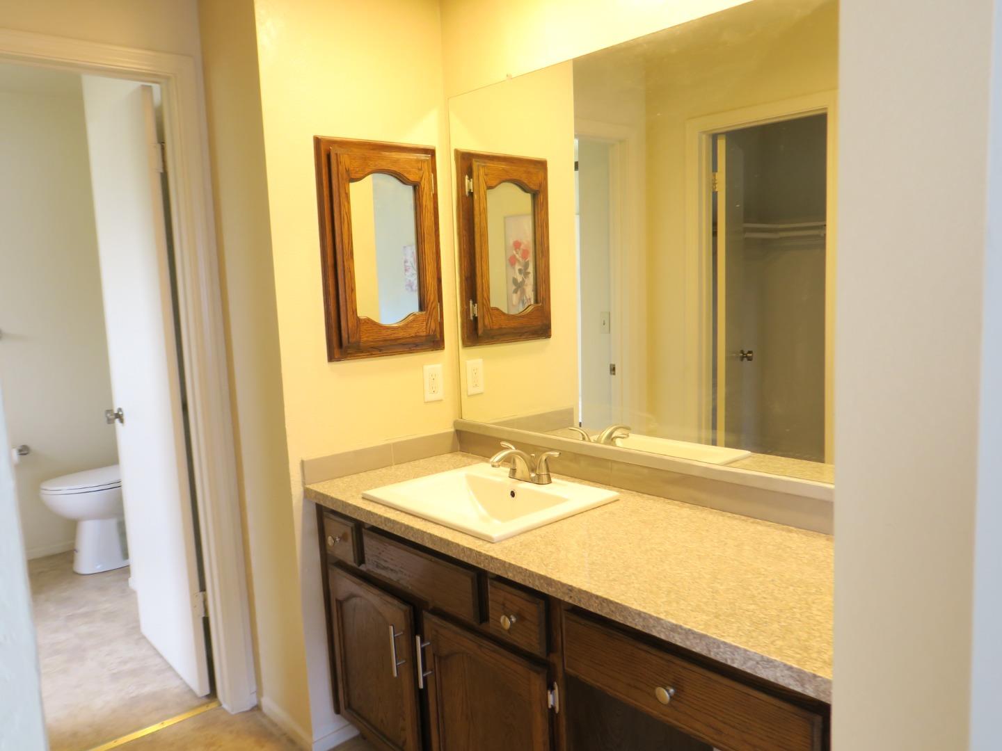 291 Klamath Road Milpitas, CA 95035 - Photo 10 of 20 a bathroom with a sink and a mirror