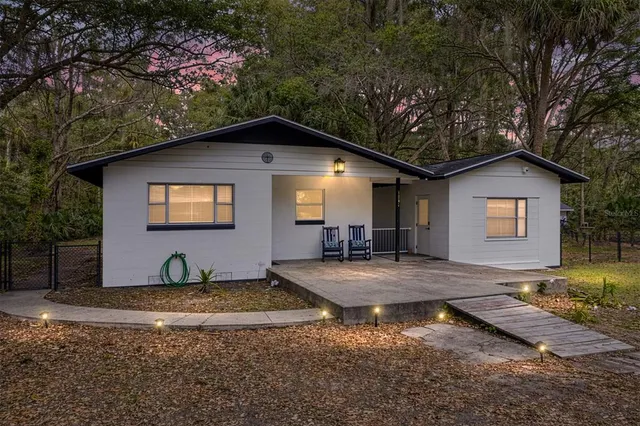 a front view of a house with yard