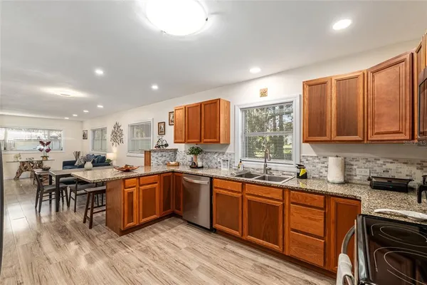 a kitchen with lots of counter top space and dining table