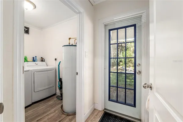 a utility room with closet dryer and washer