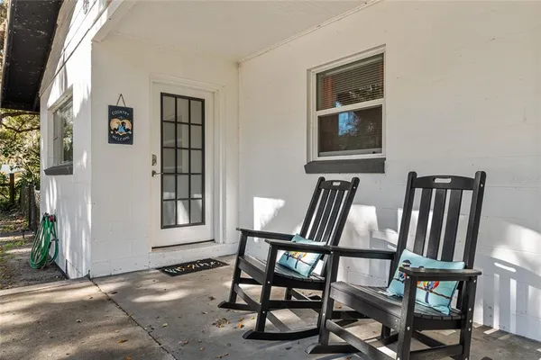 a view of a livingroom with furniture and windows