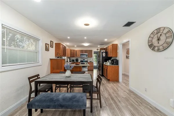 a view of a dining room with furniture and wooden floor