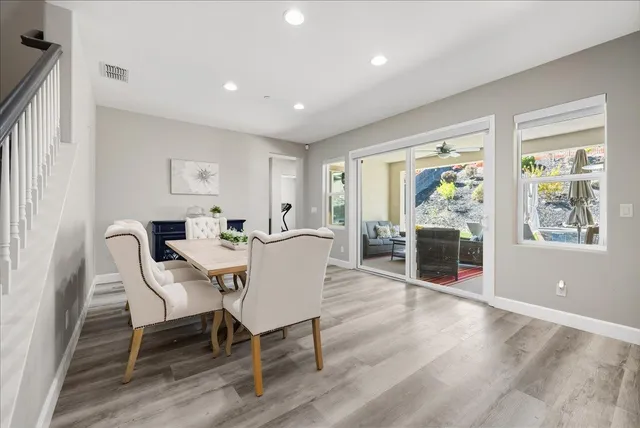 a view of a dining room with furniture window and wooden floor