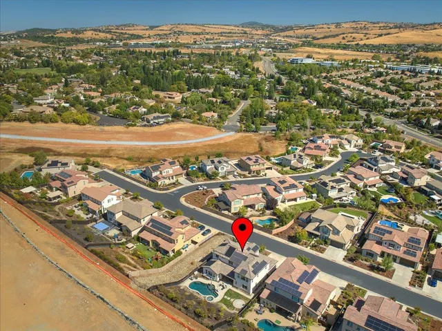 an aerial view of residential building and ocean view