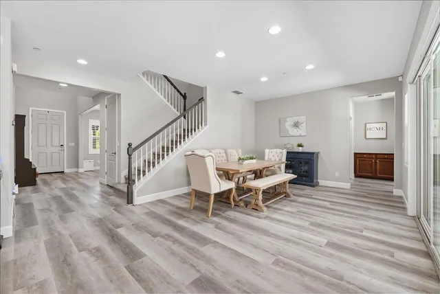 a view of a livingroom with furniture and wooden floor