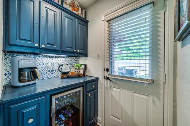 a kitchen with stainless steel appliances granite countertop a stove top oven a sink dishwasher and cabinets with wooden floor