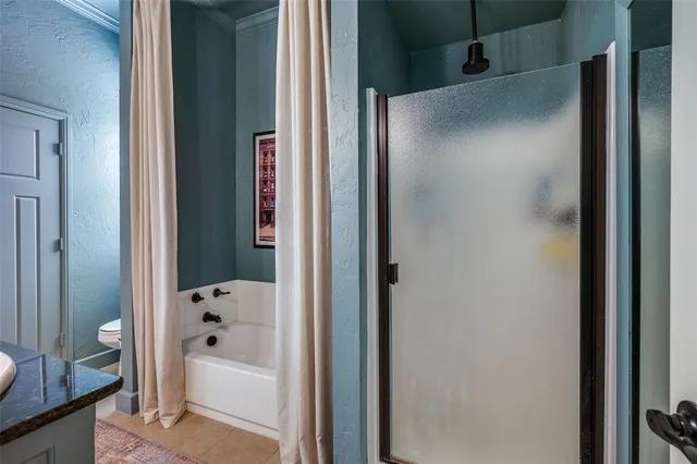 a en suite bathroom with a sink double vanity and a mirror