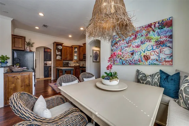 a dining room with furniture and wooden floor