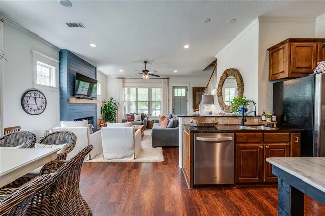 a kitchen with stainless steel appliances granite countertop a stove and a refrigerator