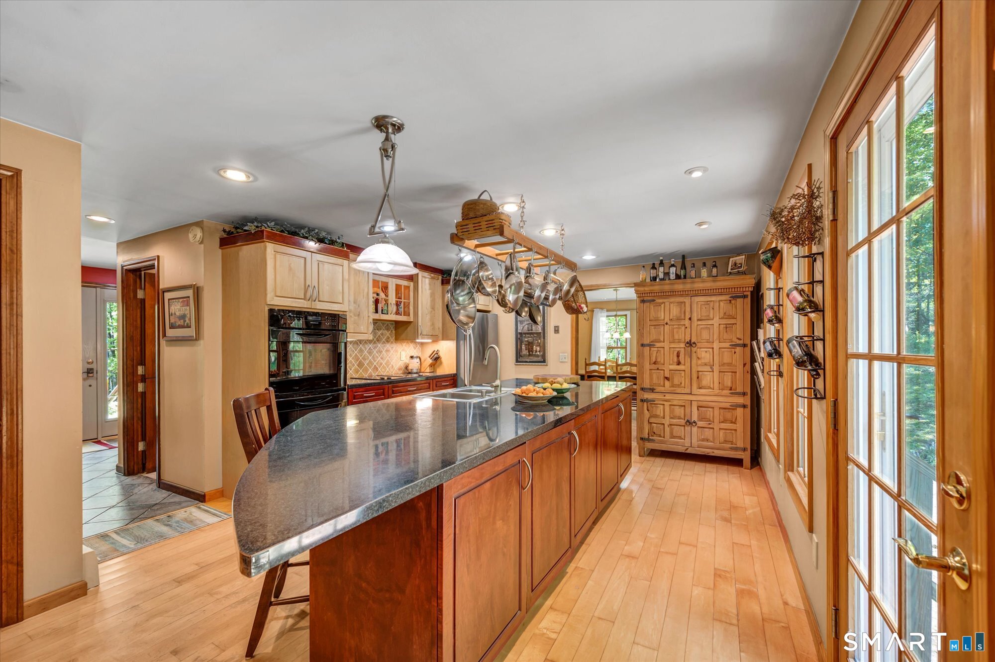 59 Indian Hill Road Canton, CT 06019 - Photo 11 of 39 a kitchen with stainless steel appliances granite countertop sink stove and refrigerator
