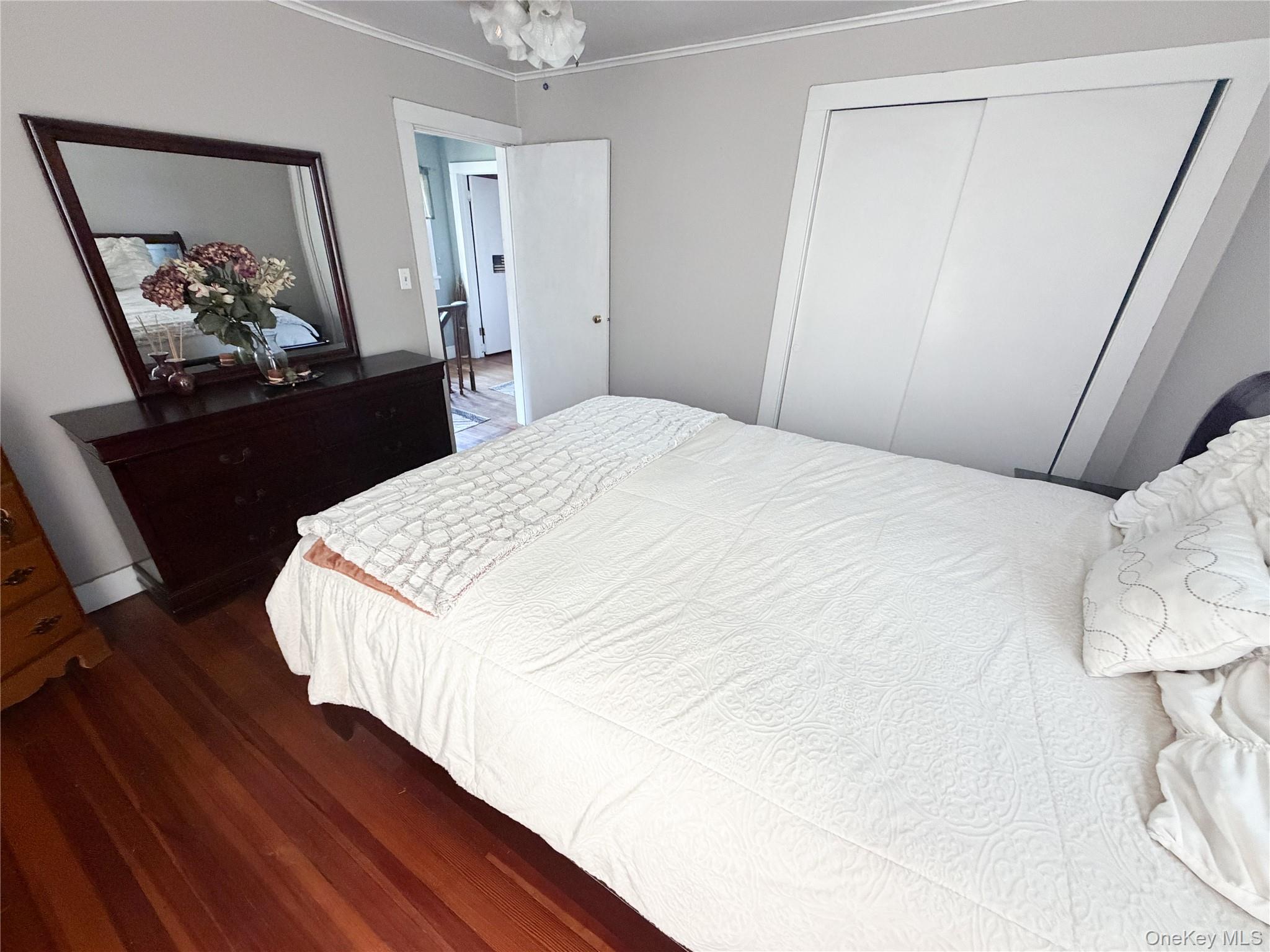 77 Rockland Road Roscoe, NY 12776 - Photo 19 of 20 Hardwood flooring throughout, featuring a built-in sliding closet, and a white interior door