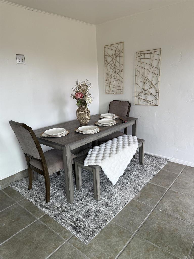 435 Rancho Camino Fallbrook, CA 92028 - Photo 30 of 42 a view of a dining room with furniture and wooden floor