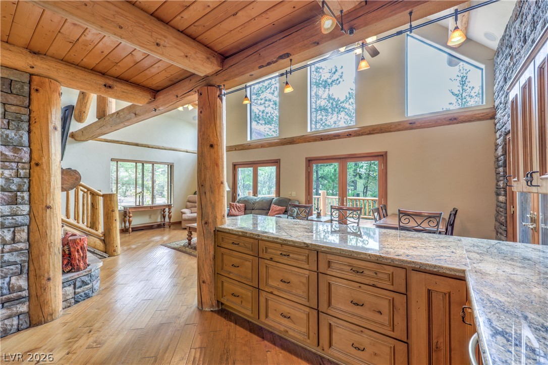 322 Ski Trail Road Mount Charleston, NV 89124 - Photo 16 of 58 Massive exposed logs and rich stone accents define this dramatic open-concept living space.