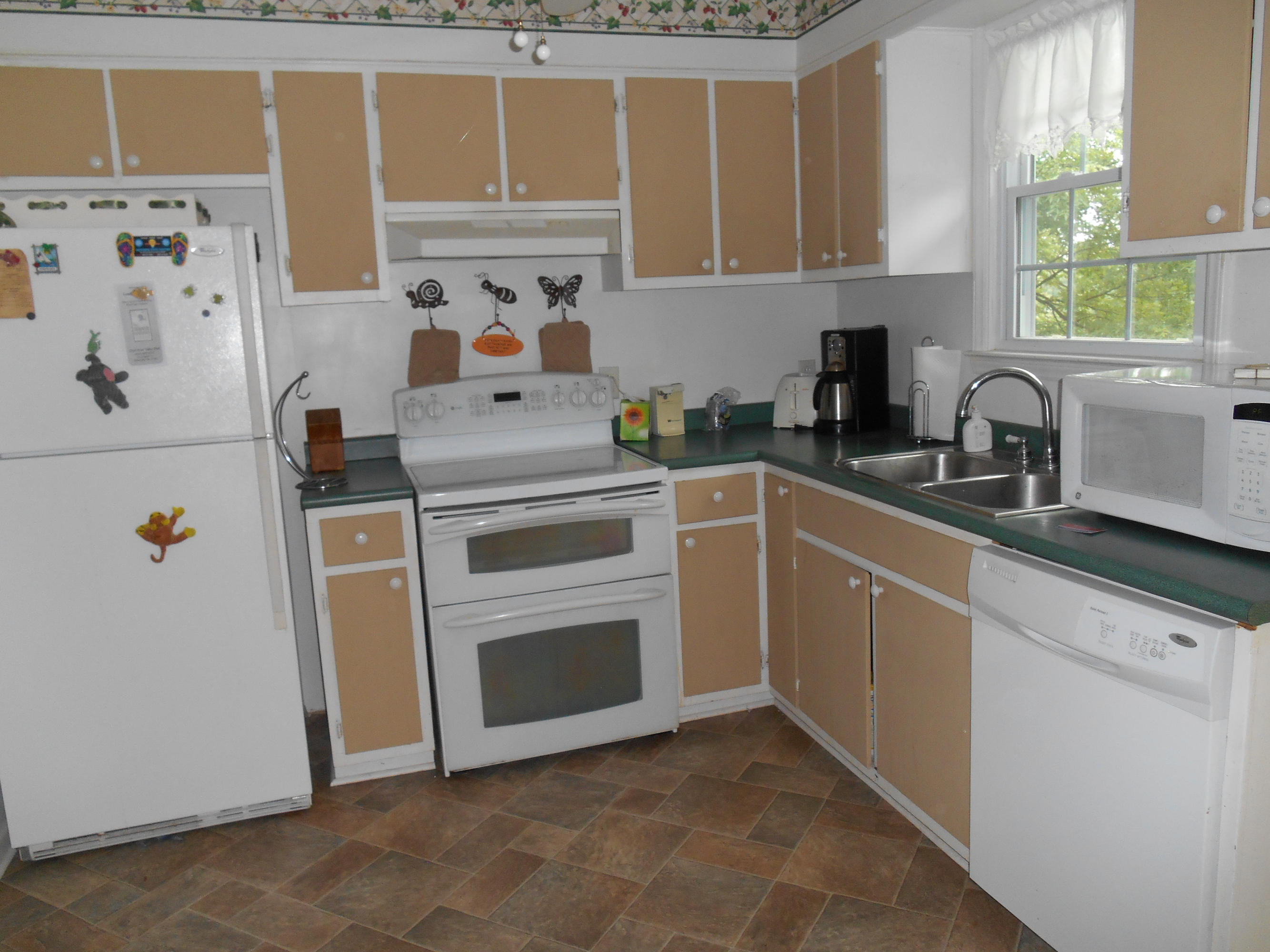 384 Lakeside Road Penhook, VA 24137 - Photo 20 of 24 a kitchen with cabinets appliances and a window