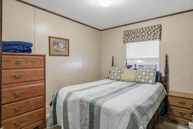 a bedroom with a bed and a cabinets