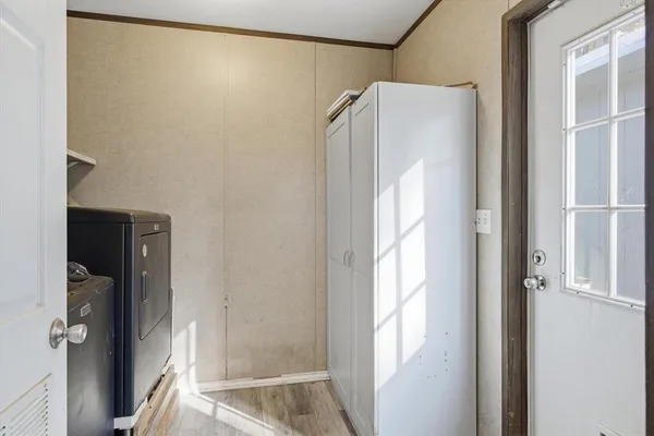 a bathroom with a glass shower door and a shower