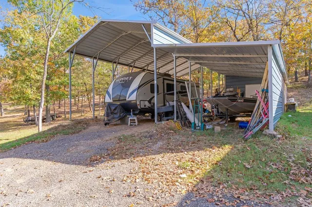 a view of a car park in front of a house