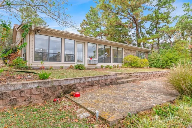 a view of a lake with houses in the back