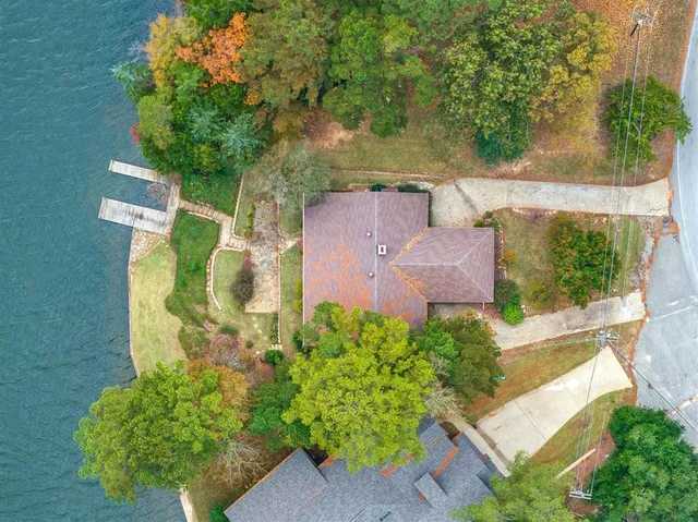 an aerial view of a house with a yard and garden