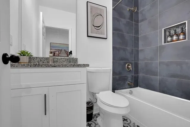 a bathroom with a sink a toilet and a bathtub