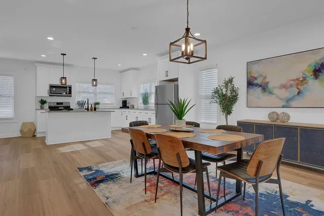 a view of a dining room with furniture and wooden floor